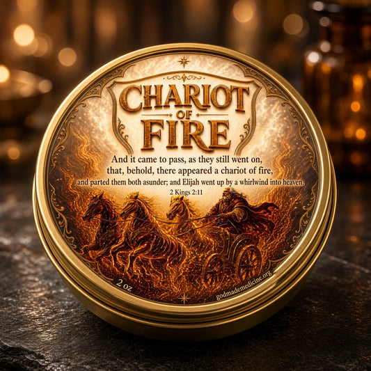 A round gold-toned tin with a decorative lid reading “Chariot of Fire” and featuring an illustrated fiery chariot scene, photographed on a dark textured surface with warm blurred lights in the background.

