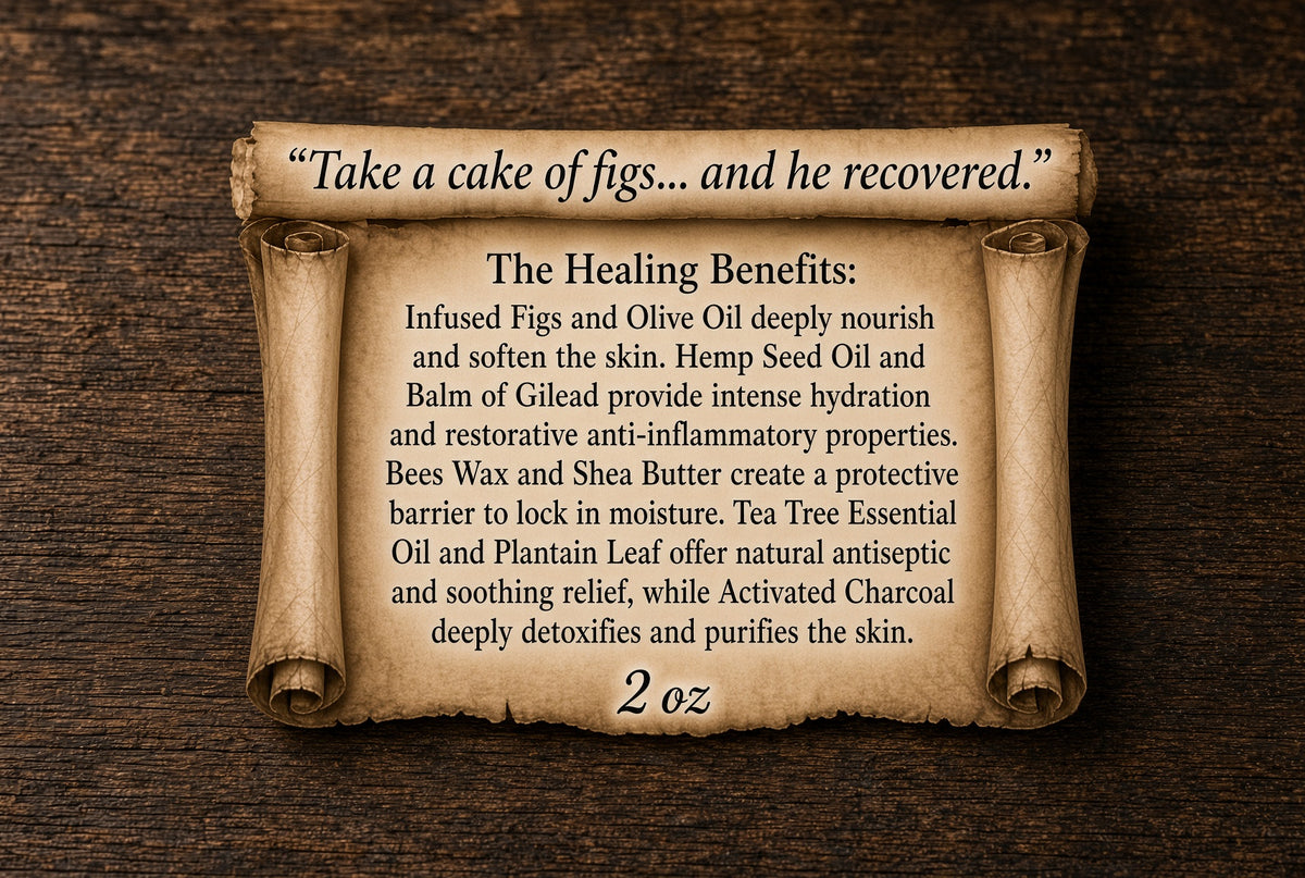 A parchment-style scroll with rolled edges on a dark wood background, displaying text about the healing benefits of a skincare product. The top of the scroll reads, “Take a cake of figs.

